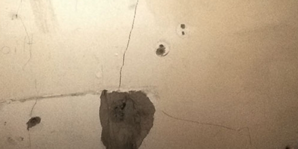 Security is a major concern. HD's project office is located in the former ‘Green Zone’ — where now security rests with the Iraqi Army. Image: bullet marks on office wall. 